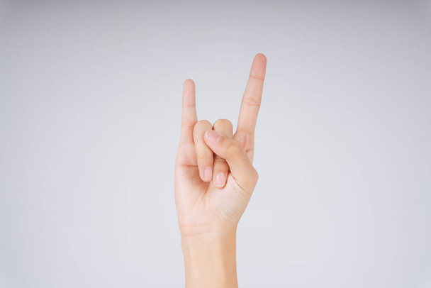 Man hand rocker on Isolated white background. The devil horns gesture. - Foto, immagini