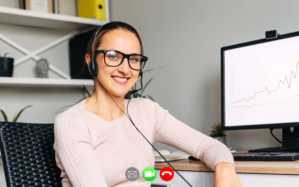 Video call with young woman employee - Фото, зображення