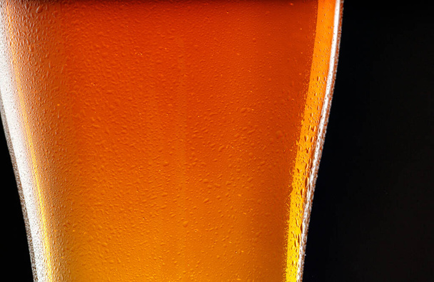 Glass of beer on black background, copy space - Fotó, kép