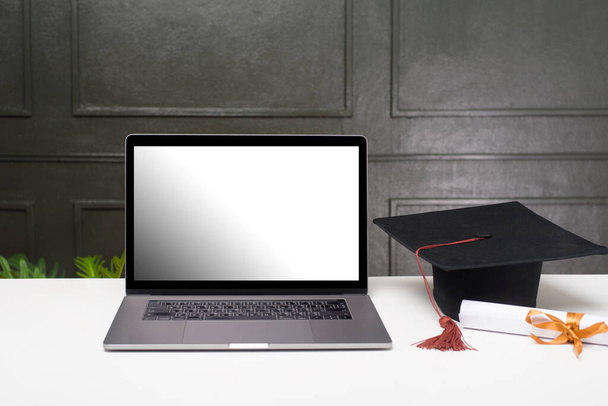 Graduation hat  and certificate with laptop mockup - Zdjęcie, obraz