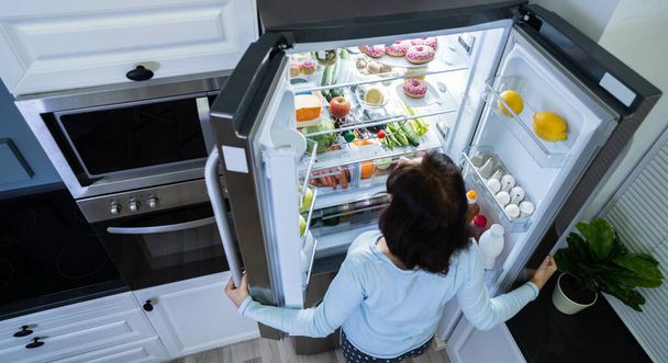 Hungry Woman At Night With Open Fridge - Foto, Imagem