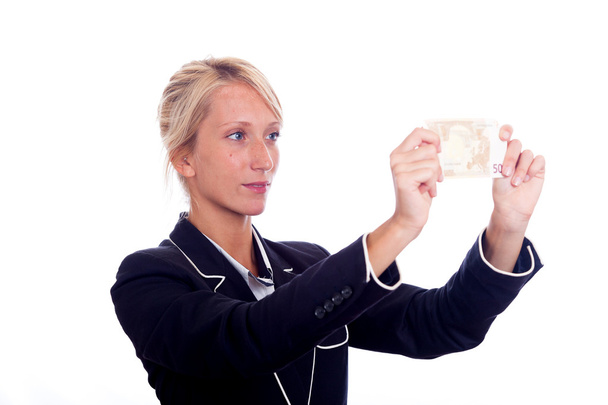 ビジネスの若い女性見てユーロ紙幣 - 写真・画像