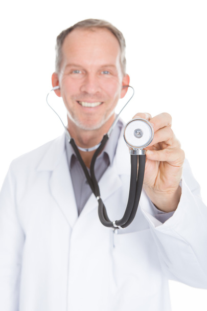 Portrait Of Male Doctor Examining - Фото, изображение