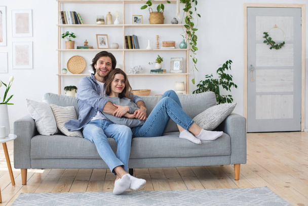 Photo of relaxed man and woman spending weekend at home - Photo, Image
