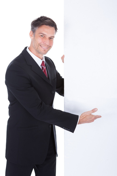 Businessman Presenting Placard - Фото, зображення