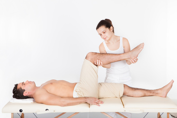 Woman Massaging Man's Foot - Foto, imagen