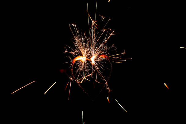 Fire sparklers on black background - Image - Photo, Image