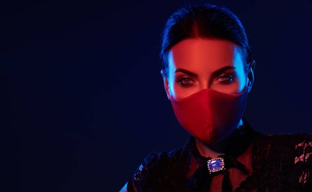 Stylish woman model  wearing designer cloth  face mask protect against coronavirus. Reusable fashionable face mask.  - Фото, зображення