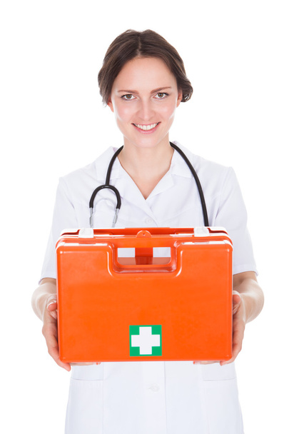 Female Doctor Holding First Aid Box - Foto, imagen