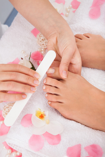 Beautician Filing The Nails Of Woman - Foto, imagen