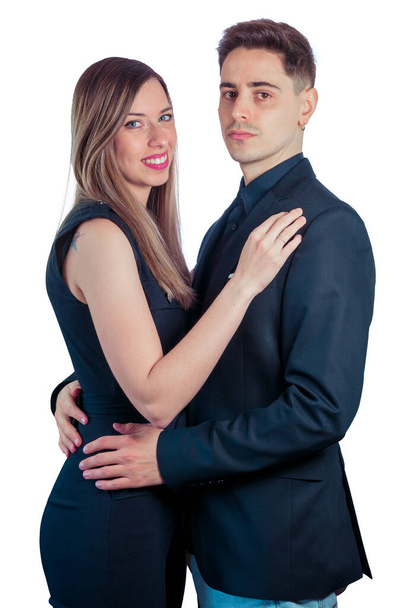 Young couple black dressed on a white background - Foto, afbeelding