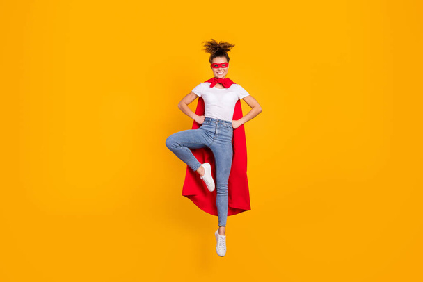 Full length body size view of her she nice attractive lovely cheerful cheery funky girl jumping wearing cape posing having fun isolated on bright vivid shine vibrant yellow color background - 写真・画像