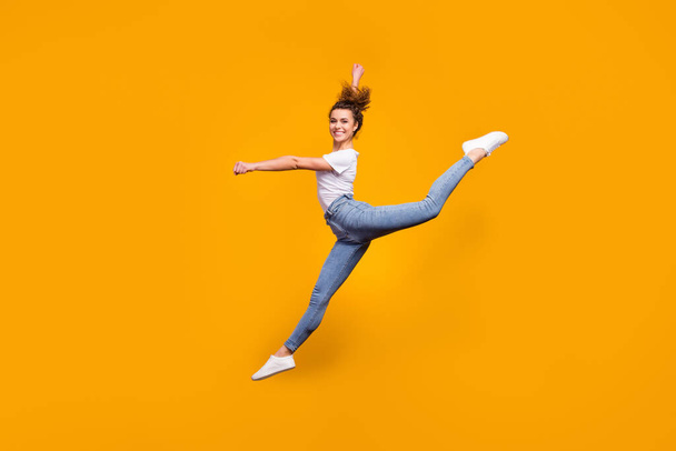 Full length body size view of her she nice attractive lovely perfect slender thin graceful curvy figure cheerful girl jumping dancing isolated on bright vivid shine vibrant yellow color background - Foto, Imagen