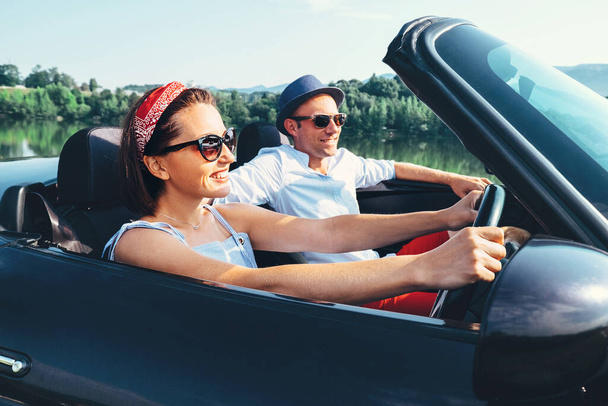 Summer voyage in cabriolet car: couple in love ride in car - Фото, зображення