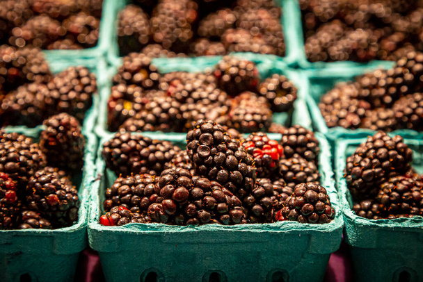 Punnets of blackberries for sale on a market stall - Фото, зображення