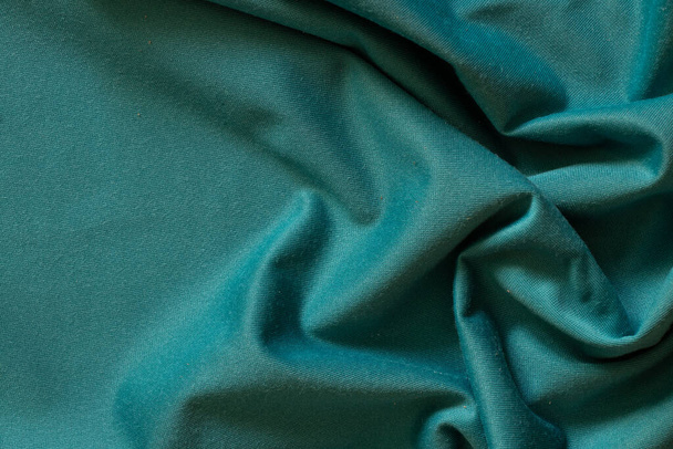 plain dark blue crumpled fabric as a background close up - Foto, Imagen