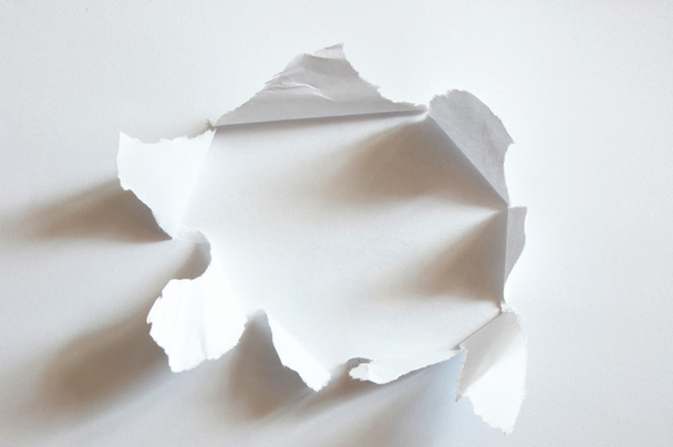 Hole in paper - Foto, afbeelding