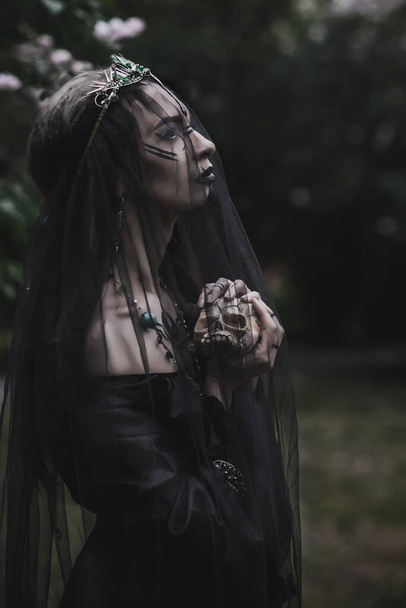 girl in a gothic gloomy image in a lilac - Фото, изображение