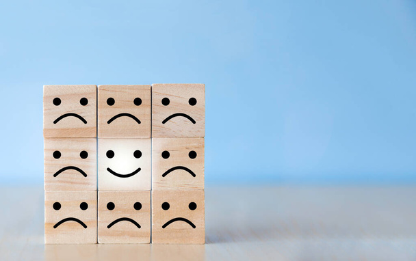 Wooden blocks with the happy face smile on the table, evaluation, Increase rating, Customer experience, satisfaction, with copy space. - Photo, Image