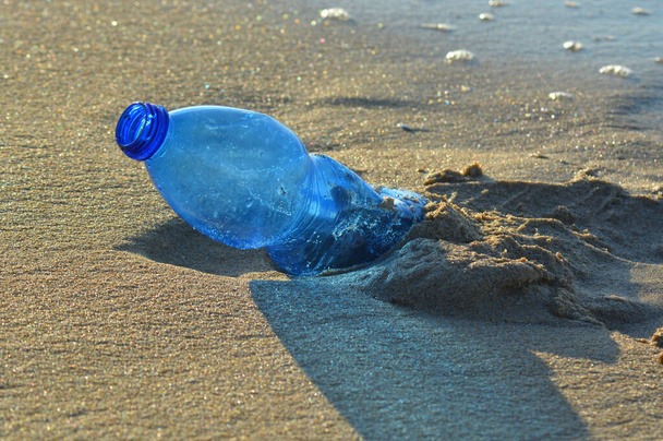 Pllastic bottle pollution on a sandy beach. - Photo, Image
