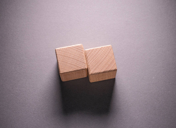 Wooden Geometric Shapes Cube on a paper background , This can use for past your words - 写真・画像