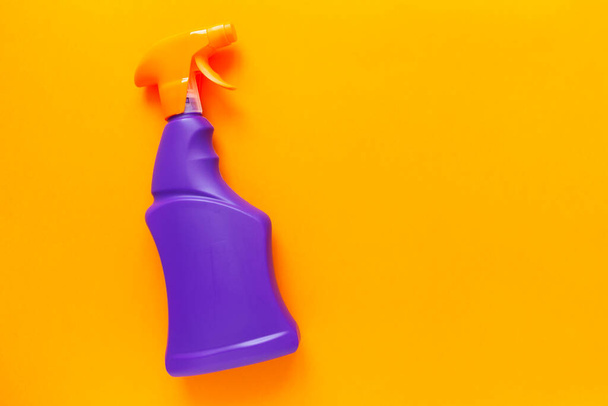 Detergents and cleaning products agent, orange background. Top view. Copy space - Фото, изображение