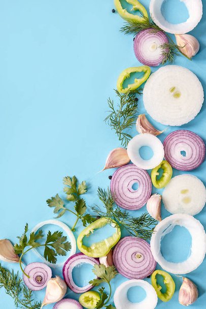 Onion rings on blue background - Photo, Image