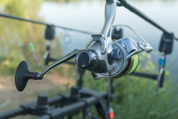Carp Spinning Reel Angling Rods On Pod Standing. Carp Rods