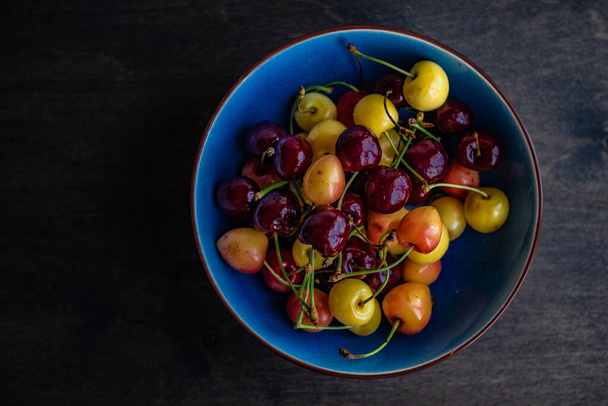 Ripe and organic sweet cherry berries in a box - Fotografie, Obrázek
