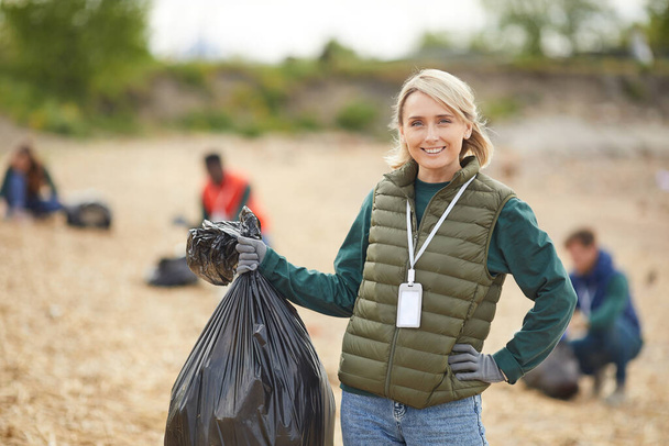 Young woman with garbage - Photo, Image