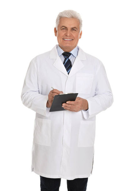 Happy senior man in lab coat with clipboard on white background - Foto, Imagen