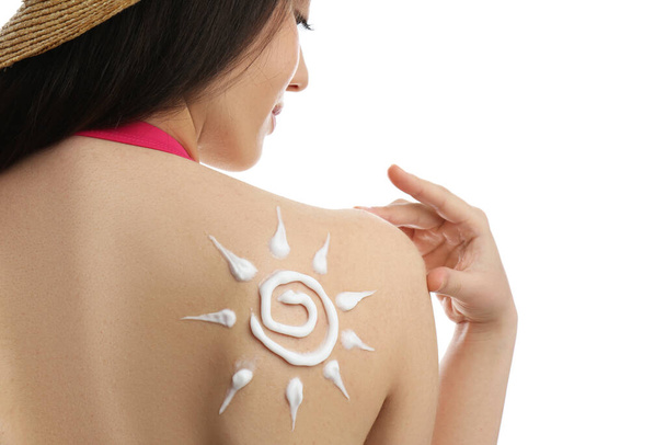 Young woman with sun protection cream on her back against white background, closeup - Foto, Imagen