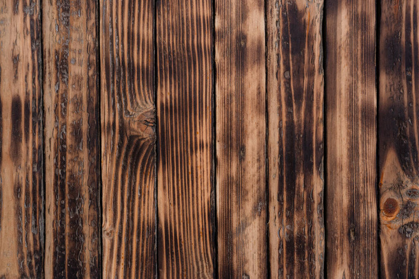 Natural burnt wood background, plenty of space for lettering. Open space. The texture of the boards. - Фото, зображення