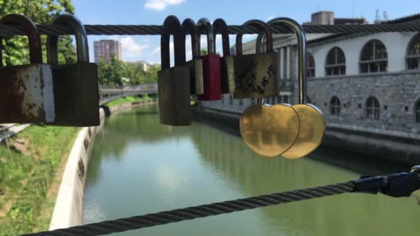Love locks at the Butchers Bridge over the Ljubljanica river in the old town of Ljubljana Slovenia - Footage, Video
