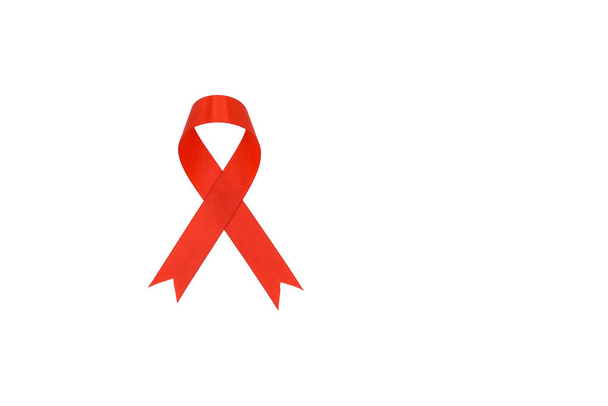 Aids awareness sign red fabric ribbon isolated on white background - Photo, Image