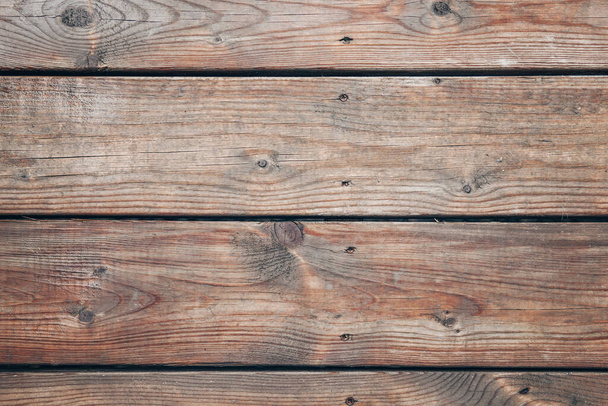 Gros plan macro de la surface des planches de bois. abstrait naturel brun rouge texture en bois fond d'écran.  - Photo, image