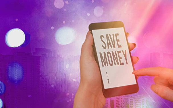 Word writing text Save Money. Business concept for to budget or put money aside for the future or emergency Modern gadgets with white display screen under colorful bokeh background. - Photo, Image