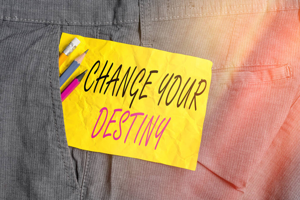 Word writing text Change Your Destiny. Business concept for choosing the right actions to manipulate predetermined events Writing equipment and yellow note paper inside pocket of man work trousers. - Photo, Image