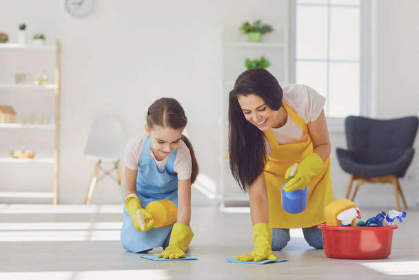 Happy smiling family cleans the living room - Foto, Imagem