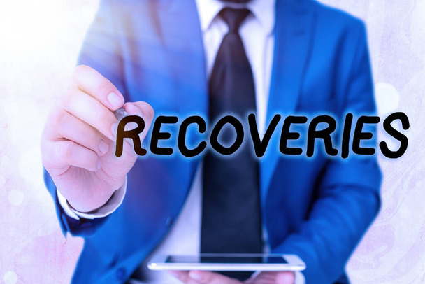 Word writing text Recoveries. Business concept for process of regaining possession or control of something lost Touching screen digital application marking important details in business. - Photo, Image