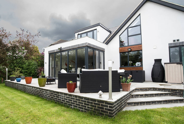 Modern luxury home and garden patio  - Фото, изображение
