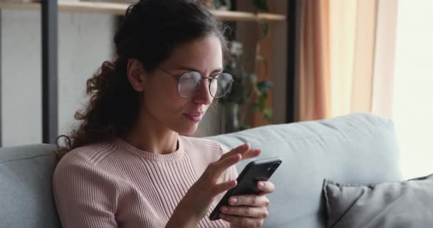 Euphoric young attractive woman reading sms with good news. - Felvétel, videó