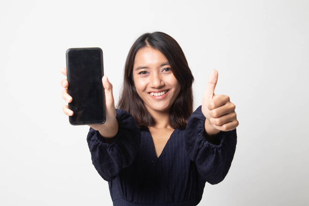 Young Asian woman show thumb up  with mobile phone on white background - Фото, зображення