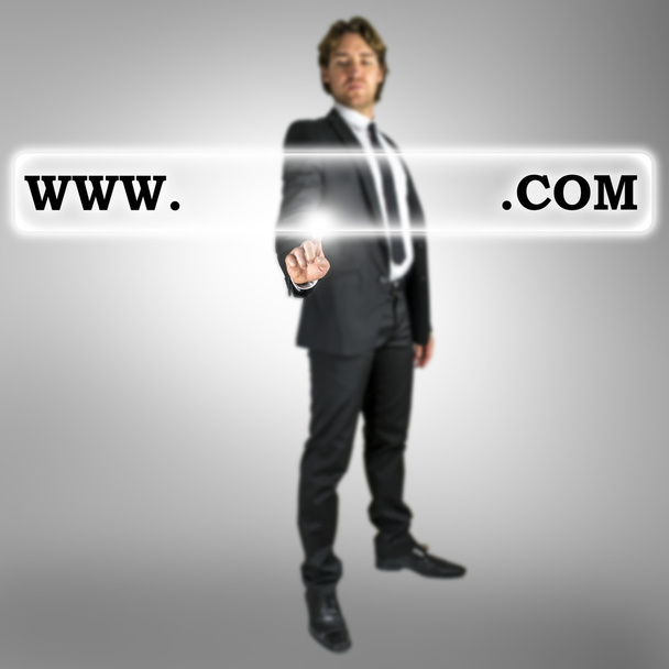 Businessman activating a website address bar - Photo, Image