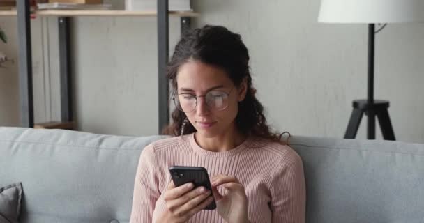 Euphoric lady reading sms with good news on smart phone. - Felvétel, videó