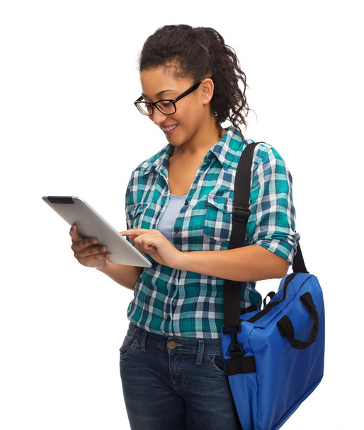 Student in eyeglasses with tablet pc and bag - Фото, изображение