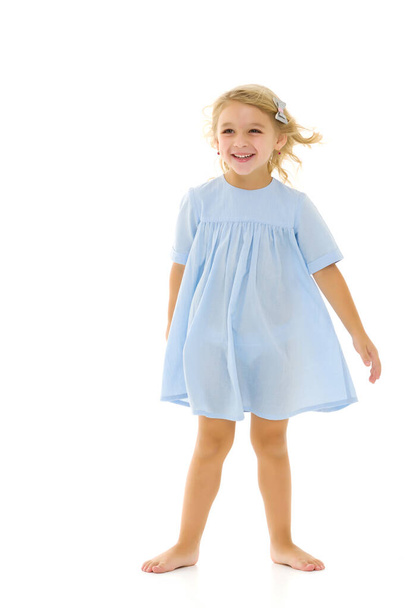 Little girl in an elegant dress.The concept of a happy childhood, healthy lifestyle. - Photo, image
