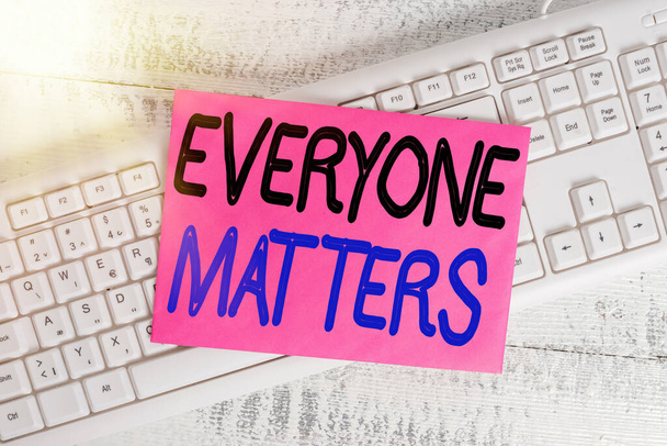 Word writing text Everyone Matters. Business concept for listen to all the voices at the table no bias or preference White keyboard office supplies empty rectangle shaped paper reminder wood. - Photo, Image