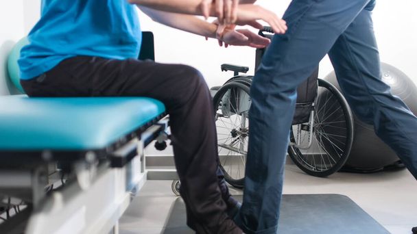Physiotherapist with disabled person - Φωτογραφία, εικόνα