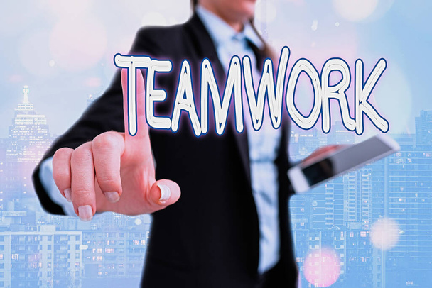 Writing note showing Teamwork. Business photo showcasing the group s is collaborative effort to accomplish a common goal Touch screen digital marking important details in business. - Photo, Image